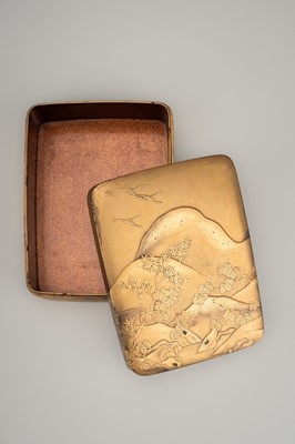 Lot 112 - A GOLD LACQUER KOBAKO DEPICTING A RIVER LANDSCAPE