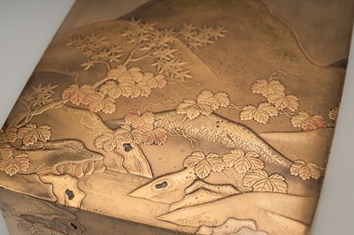 Lot 112 - A GOLD LACQUER KOBAKO DEPICTING A RIVER LANDSCAPE