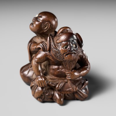 Lot 221 - MIWA: A RARE WOOD NETSUKE OF A BLIND MASSEUR AND SHOKI