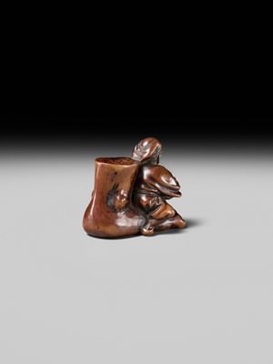 Lot 230 - HOSHUNSAI MASAYUKI: A FINE WOOD NETSUKE OF A CARVER CHISELING A GIANT FOOT