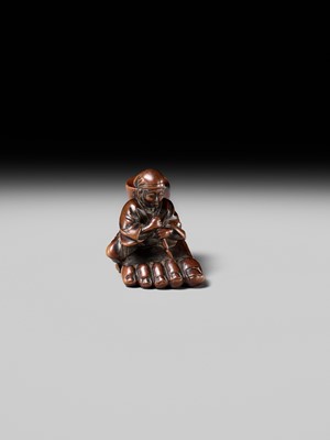 Lot 230 - HOSHUNSAI MASAYUKI: A FINE WOOD NETSUKE OF A CARVER CHISELING A GIANT FOOT