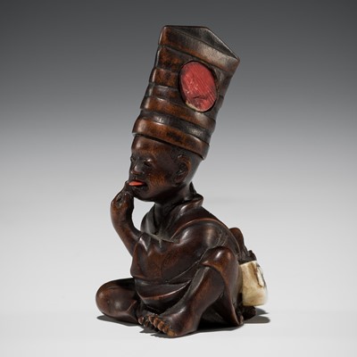 Lot 1396 - A WOOD NETSUKE OKIMONO OF A BOY DRESSED AS A SAMBASO DANCER WITH HANNYA MASK