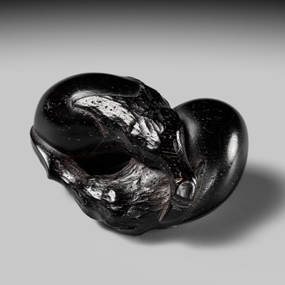 Lot 110 - A SUPERB EBONY WOOD NETSUKE OF TWO NASUBI (EGGPLANTS), ATTRIBUTED TO KAIGYOKUSAI MASATSUGU