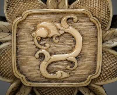 Lot 472 - A FINE WALRUS TUSK RYUSA MANJU NETSUKE OF A WATER DRAGON (AMARYU)