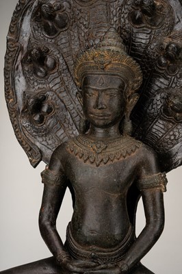 Lot 1063 - A LARGE KHMER-STYLE BRONZE FIGURE OF BUDDHA MUCHALINDA