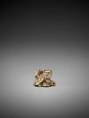 Lot 64 - HAKURYU: AN IVORY NETSUKE OF A TIGER WITH TWO CUBS