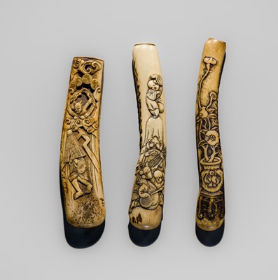 Lot 1462 - A FINE LOT WITH THREE ANTLER KISERUZUTSU (PIPE CASE)