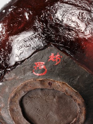 Lot 140 - A DRY LACQUER (KANSHITSU) ‘MOUNTAIN’ CHAWAN IN IMITATION OF AKA RAKU WARE