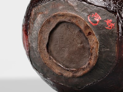 Lot 140 - A DRY LACQUER (KANSHITSU) ‘MOUNTAIN’ CHAWAN IN IMITATION OF AKA RAKU WARE