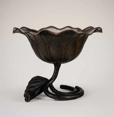 Lot 58 - A BRONZE OKIMONO OF A LOTUS LEAF