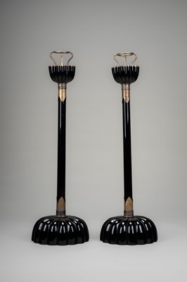 Lot 135 - A LARGE PAIR OF BLACK LACQUERED CANDLESTICKS