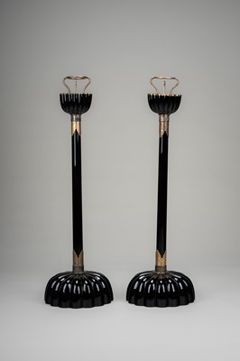 Lot 135 - A LARGE PAIR OF BLACK LACQUERED CANDLESTICKS
