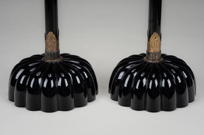 Lot 135 - A LARGE PAIR OF BLACK LACQUERED CANDLESTICKS