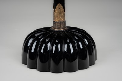 Lot 135 - A LARGE PAIR OF BLACK LACQUERED CANDLESTICKS