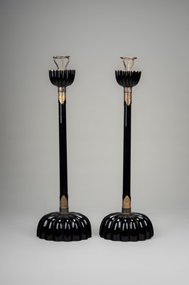 Lot 135 - A LARGE PAIR OF BLACK LACQUERED CANDLESTICKS