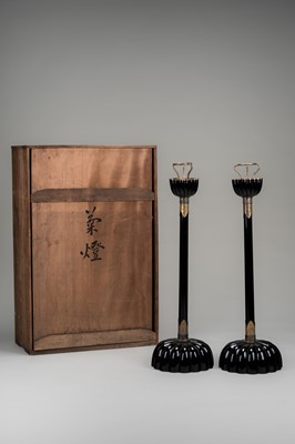 Lot 135 - A LARGE PAIR OF BLACK LACQUERED CANDLESTICKS