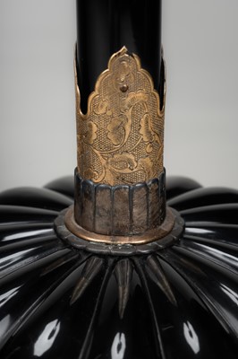 Lot 135 - A LARGE PAIR OF BLACK LACQUERED CANDLESTICKS