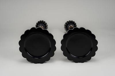Lot 135 - A LARGE PAIR OF BLACK LACQUERED CANDLESTICKS