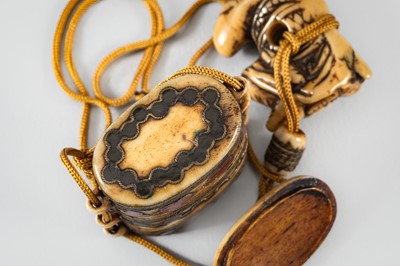 Lot 1441 - AN ENAMELED MINIATURE TWO-CASE ANTLER INRO WITH NETSUKE AND OJIME