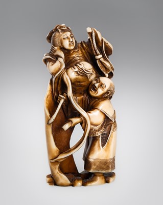 Lot 311 - AN IVORY OKIMONO OF BENTEN EMERGING FROM A SCROLL