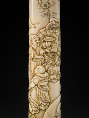 Lot 54 - A FINE IVORY KISERUZUTSU WITH THE SEVEN LUCKY GODS (SHICHIFUKUJIN)