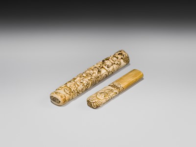 Lot 54 - A FINE IVORY KISERUZUTSU WITH THE SEVEN LUCKY GODS (SHICHIFUKUJIN)