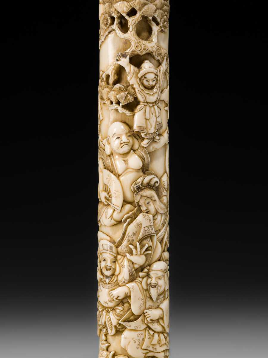 Lot 54 - A FINE IVORY KISERUZUTSU WITH THE SEVEN LUCKY GODS (SHICHIFUKUJIN)