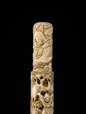 Lot 54 - A FINE IVORY KISERUZUTSU WITH THE SEVEN LUCKY GODS (SHICHIFUKUJIN)