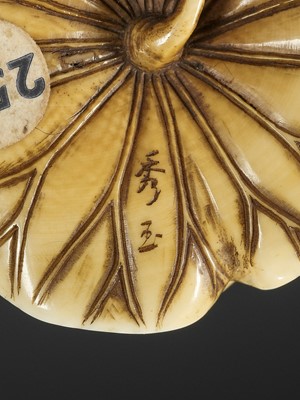 Lot 72 - SHUGYOKU: AN INLAID IVORY NETSUKE OF JIZO AND A NIO WRESTLING ON A LOTUS LEAF