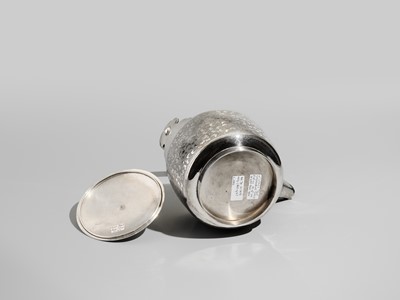 Lot 29 - A FINE AND LARGE SILVER SAKE EWER WITH PEONY FLOWERS