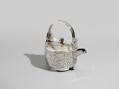 Lot 29 - A FINE AND LARGE SILVER SAKE EWER WITH PEONY FLOWERS