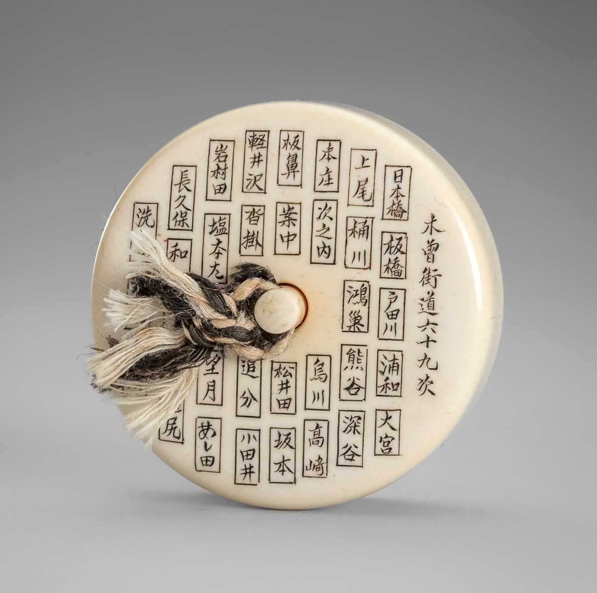 Lot 347 - A FINE IVORY MANJU NETSUKE WITH THE SIXTY-NINE STATIONS OF THE KISOKAIDO