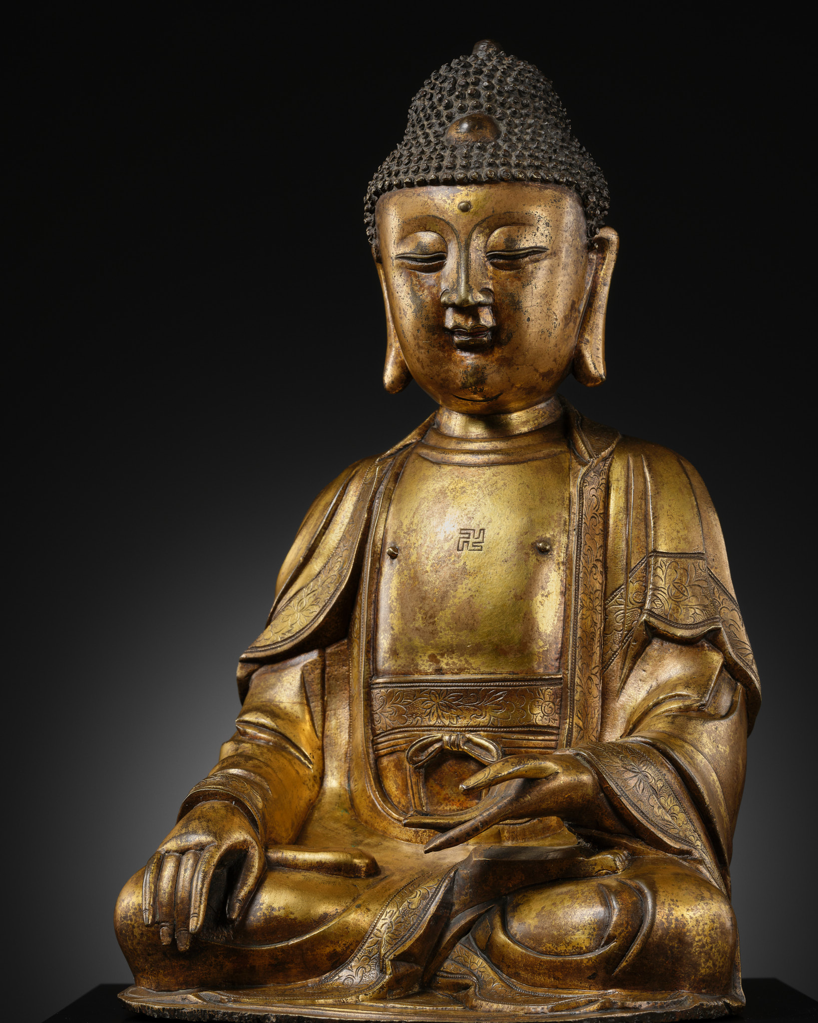 Lot 49 - A LARGE GILT-BRONZE FIGURE OF BUDDHA, MING