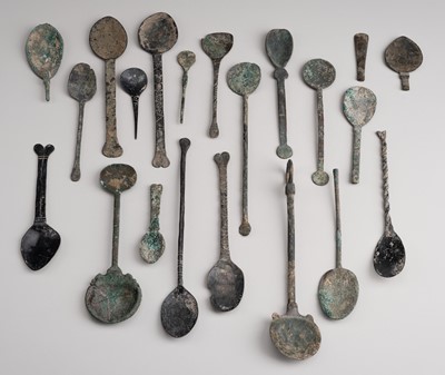 Lot 1100 - A GROUP OF 20 BRONZE SPOONS, c. 12TH TO 19th CENTURY