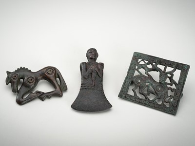 Lot 712 - A GROUP OF TWO ARCHAISTIC ORDOS-STYLE BRONZE BUCKLES AND A RITUAL AXE, 20TH CENTURY