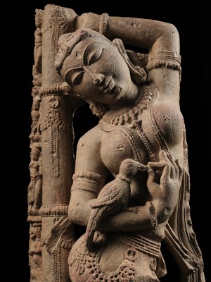 Lot 194 - A PINK SANDSTONE FIGURE OF A CELESTIAL BEAUTY, SURASUNDARI, 11TH CENTURY