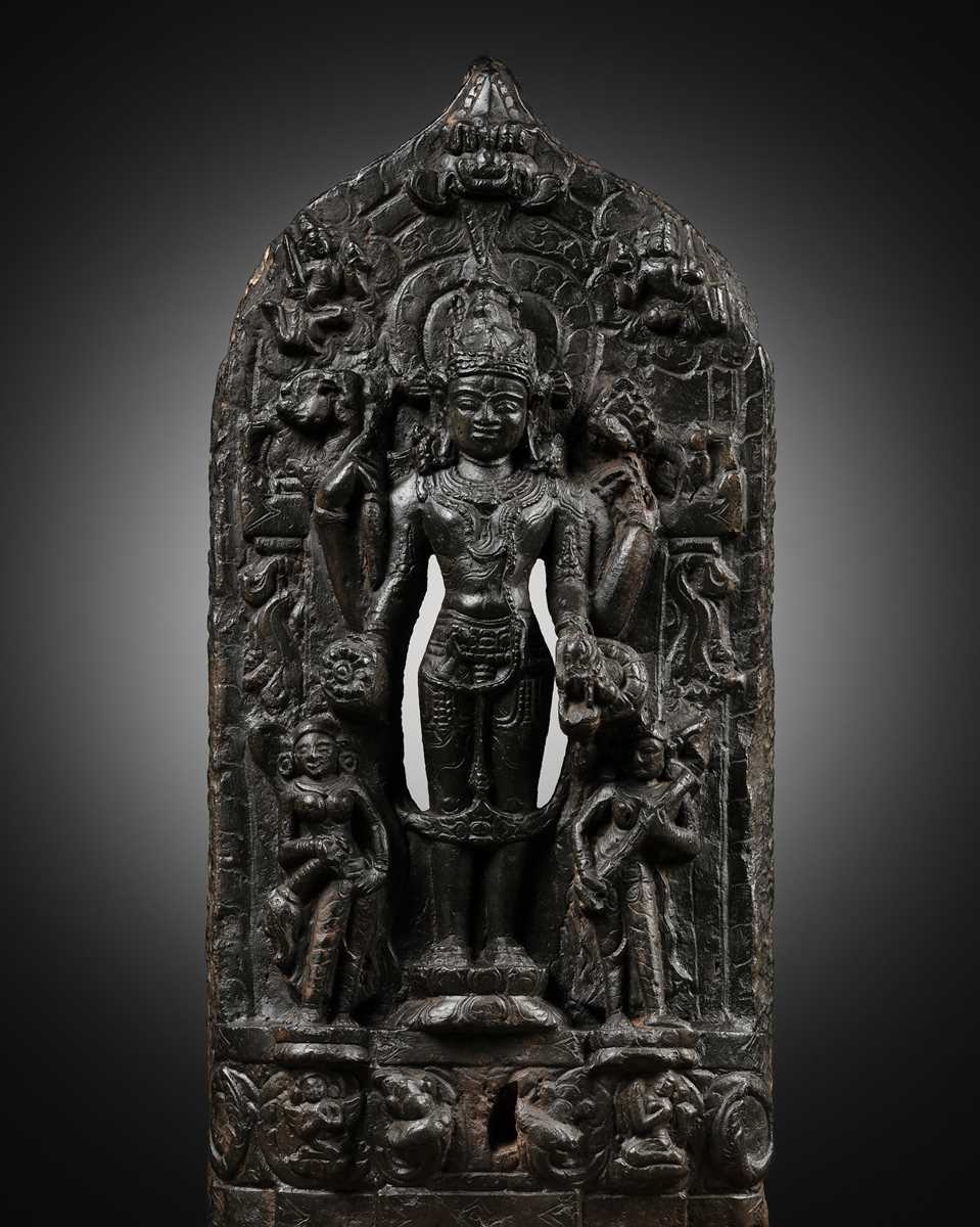 Lot 624 - A BLACK STONE STELE OF VISHNU, PALA PERIOD
