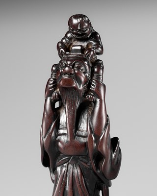 Lot 66 - A VERY LARGE AND UNUSUAL WOOD NETSUKE OF SHOKI AND ONI