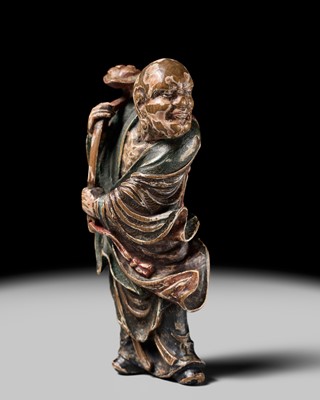 Lot 65 - A POWERFUL AND LARGE SAISHIKI NETSUKE OF A RAKAN WIELDING A NYOI SCEPTER, STYLE OF YOSHIMURA SHUZAN