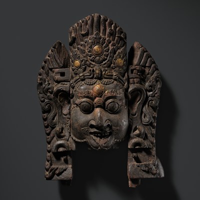 Lot 19 - A LARGE WOOD MASK DEPICTING BHAIRAVA, NEPAL, 17TH CENTURY