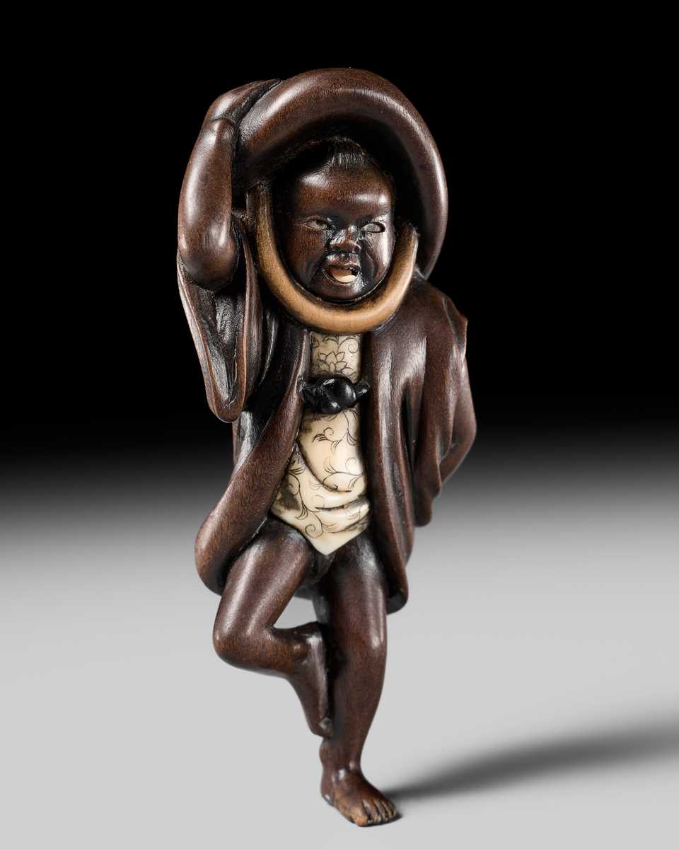 Lot 216 - MIWA: A RARE WOOD NETSUKE OF A SPARROW DANCER