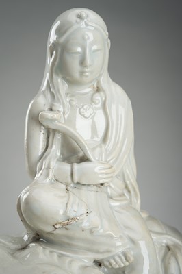 Lot 186 - A HIRADO WHITE-GLAZED PORCELAIN OKIMONO OF KANNON WITH SHISHI