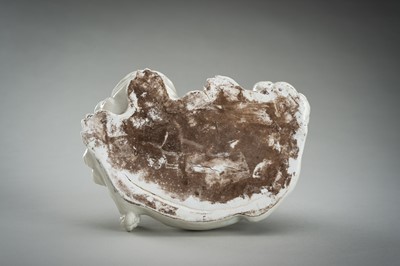 Lot 186 - A HIRADO WHITE-GLAZED PORCELAIN OKIMONO OF KANNON WITH SHISHI