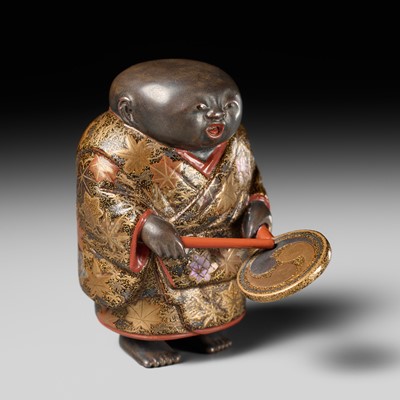 Lot 527 - A FINE AND LARGE LACQUER NETSUKE OF A GOSHO NINGYO DOLL HOLDING A DRUM