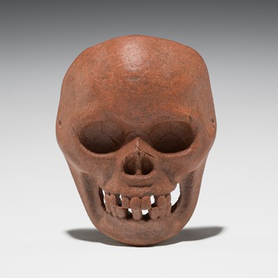 Lot 555 - A RARE ONKO POTTERY MASK NETSUKE OF A SKULL