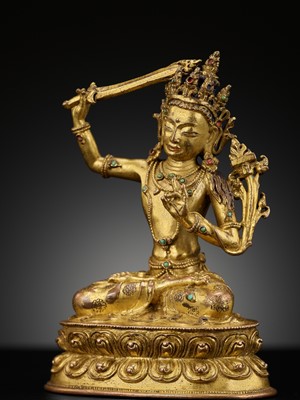 Lot 13 - A GILT-BRONZE FIGURE OF MANJUSHRI, DEDICATED TO SONAM GYALTSEN, 15TH CENTURY