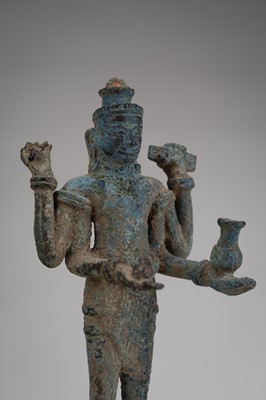 Lot 1021 - A SMALL KHMER BRONZE FIGURE OF AVALOKITESHVARA, ANGKOR PERIOD