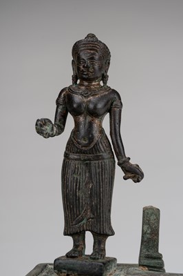 Lot 1062 - A SMALL KHMER STYLE GILT-BRONZE FIGURE OF UMA