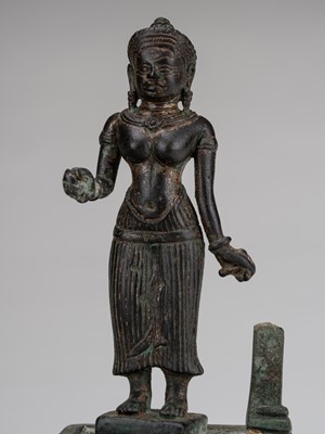 Lot 1327 - A SMALL KHMER STYLE GILT-BRONZE FIGURE OF UMA