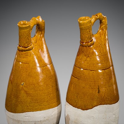 A PAIR OF AMBER-GLAZED FLASKS, LIAO DYNASTY, 11TH CENTURY